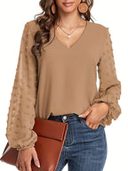 Lena | Blusa llamativa con cuello en V y manga texturizada