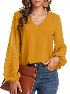 Lena | Blusa llamativa con cuello en V y manga texturizada